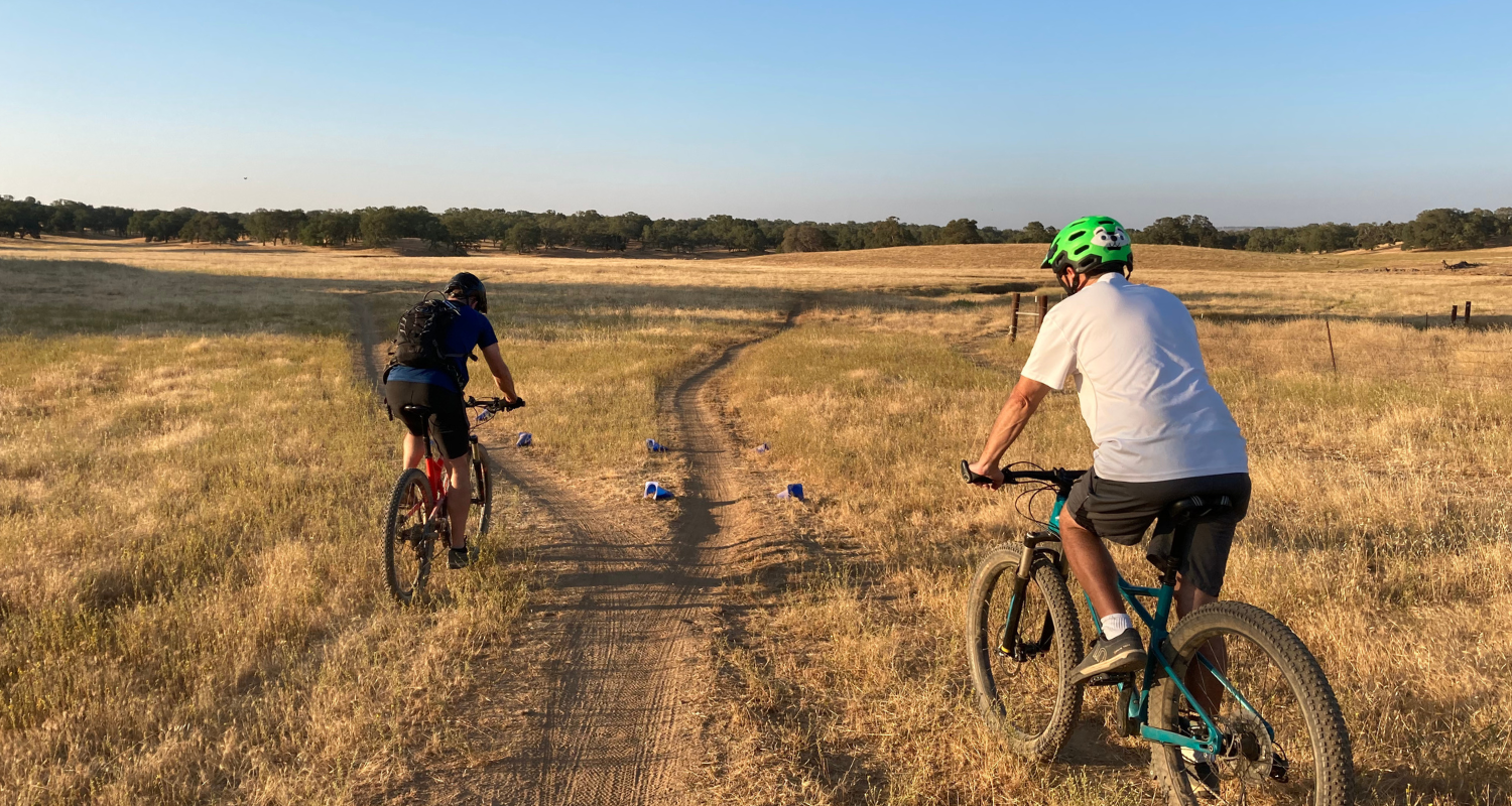 mountain bike riders in grassland